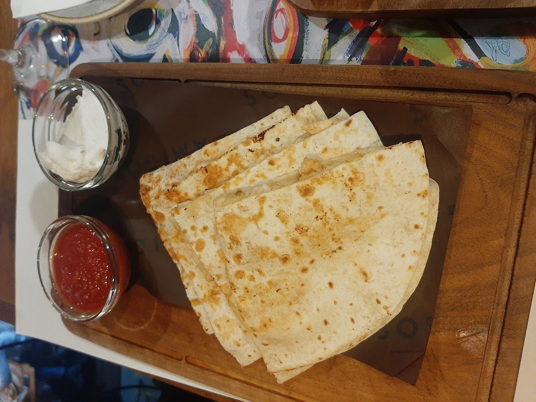 A sizzling quesadilla the most famous Mexican dish served fresh at Amigos restaurant Skopje