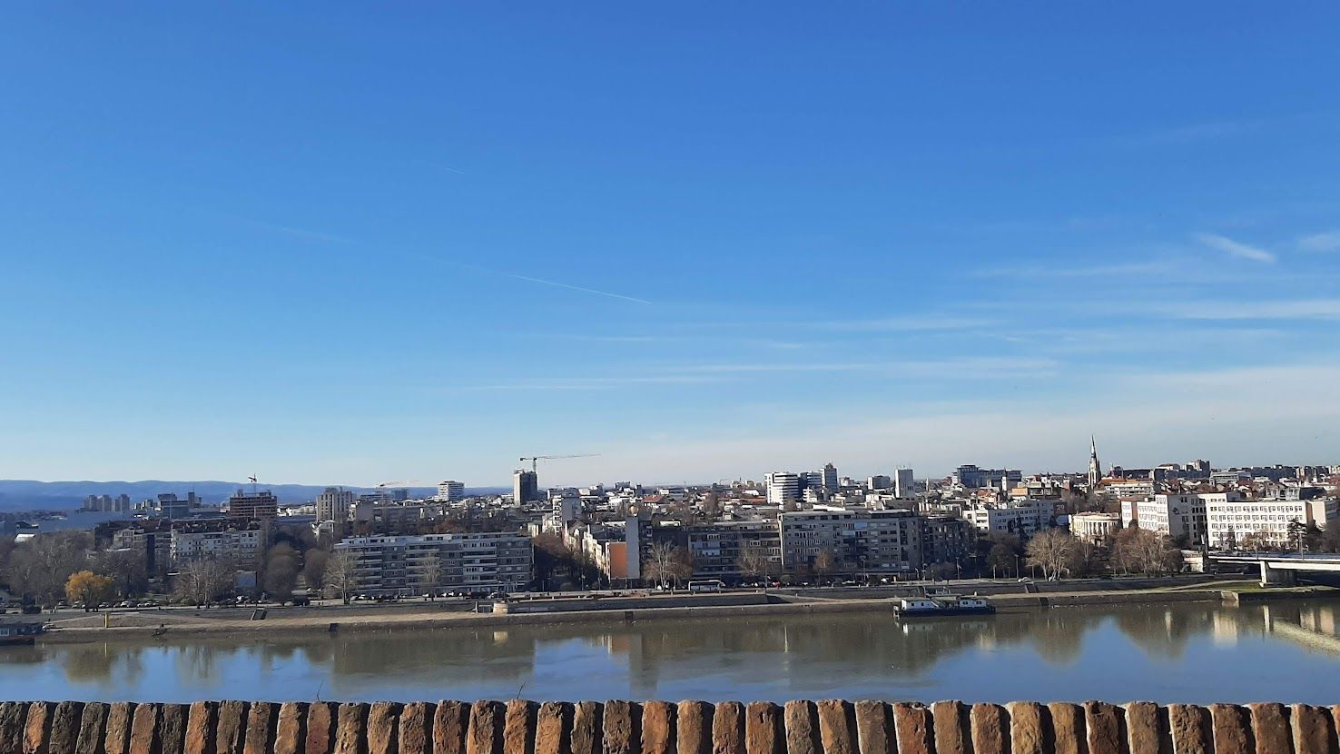 The magnificent Petrovaradin Fortress standing on the right bank of the blue Danube River in Novi Sad