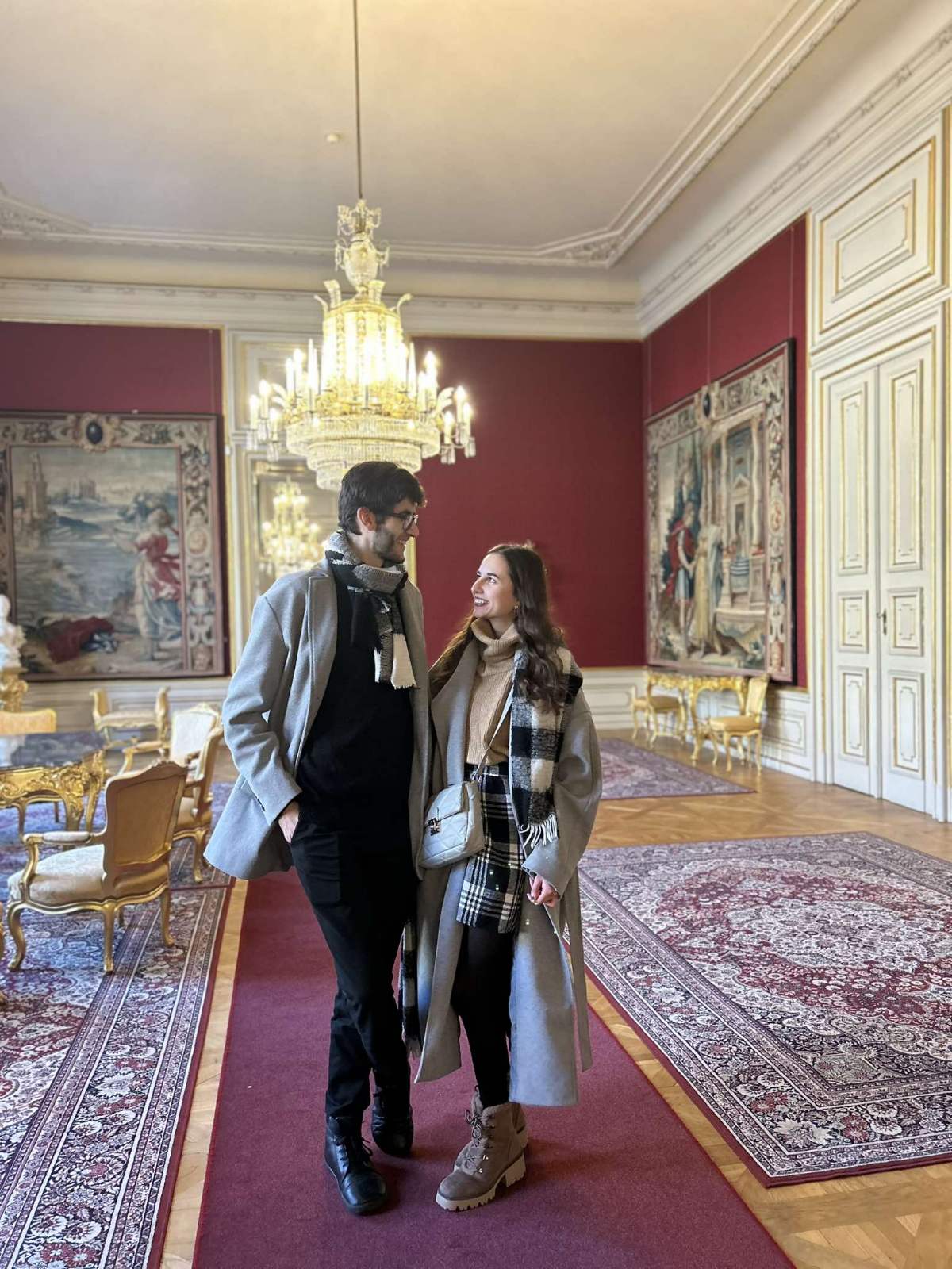 The grand hall of the Primates Palace with ornate ceiling and classical European architecture