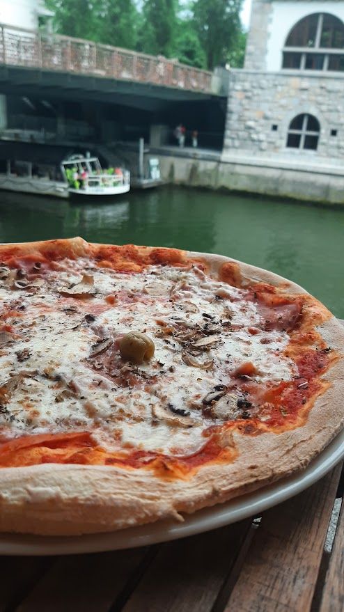 The charming Fany and Mary restaurant located beside the river with boats floating by