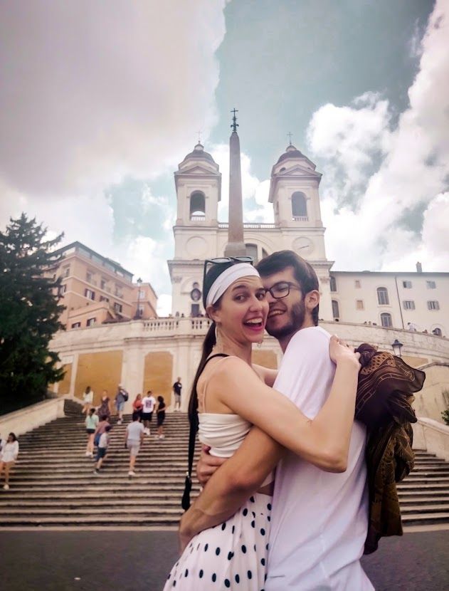 A couple at the famous Spanish Steps in Rome with 135 stairs leading to Piazza di Spagna