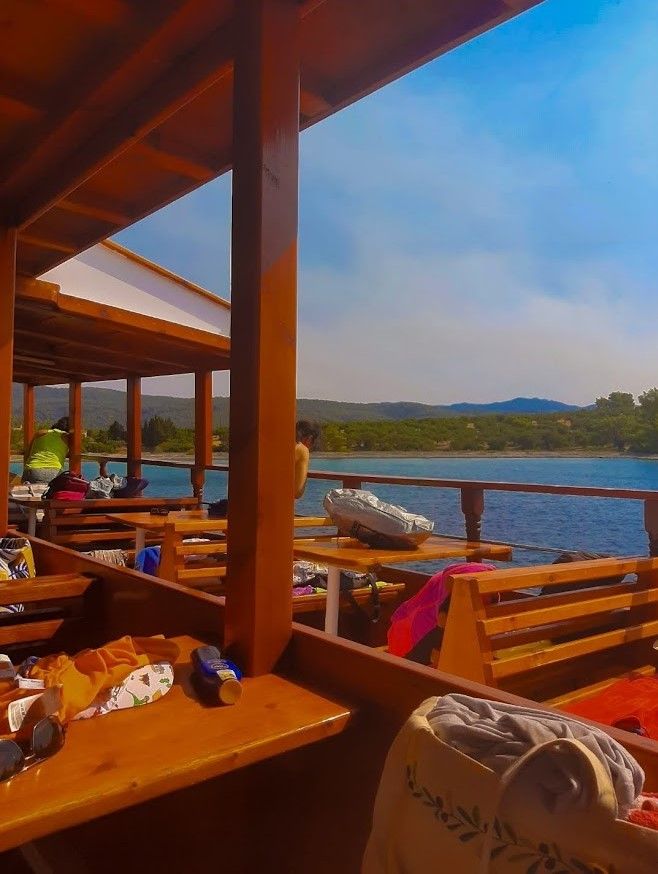 The stable comfortable boat with beautiful music taking us to the Sithonia Peninsula