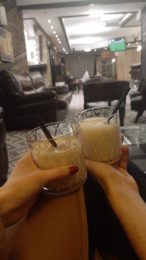 Enjoying delectable drinks in the warm lobby of Bansko Hotel surrounded by cozy atmosphere