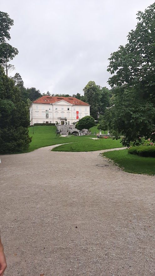 Walking through the tree-lined paths of Park Tivoli in the quiet car-free centre of Ljubljana