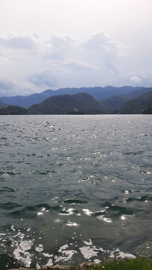 The idyllic Bled Lake nestled in the Julian Alps with a small island in the middle