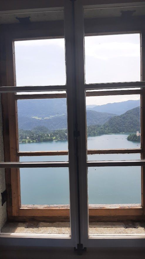 The panoramic view of Bled Lake from the castle soaking up the stunning Alpine blueness