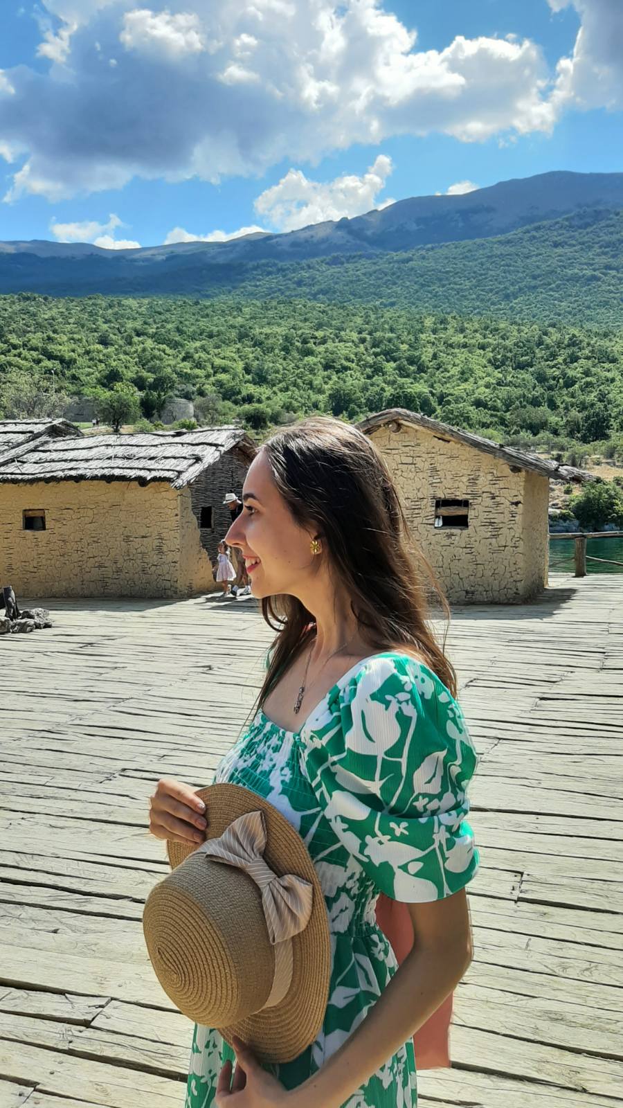 Wooden walkways connecting the prehistoric houses at the Bay of Bones museum over the turquoise Ohrid Lake
