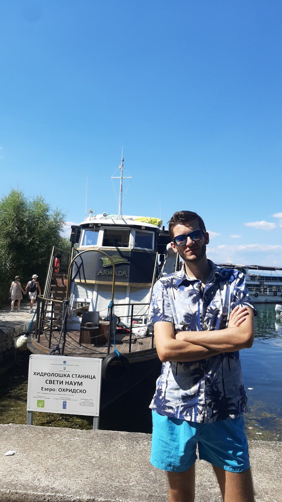 A Rafaello coffee held up against the sparkling Ohrid Lake during a scenic boat ride