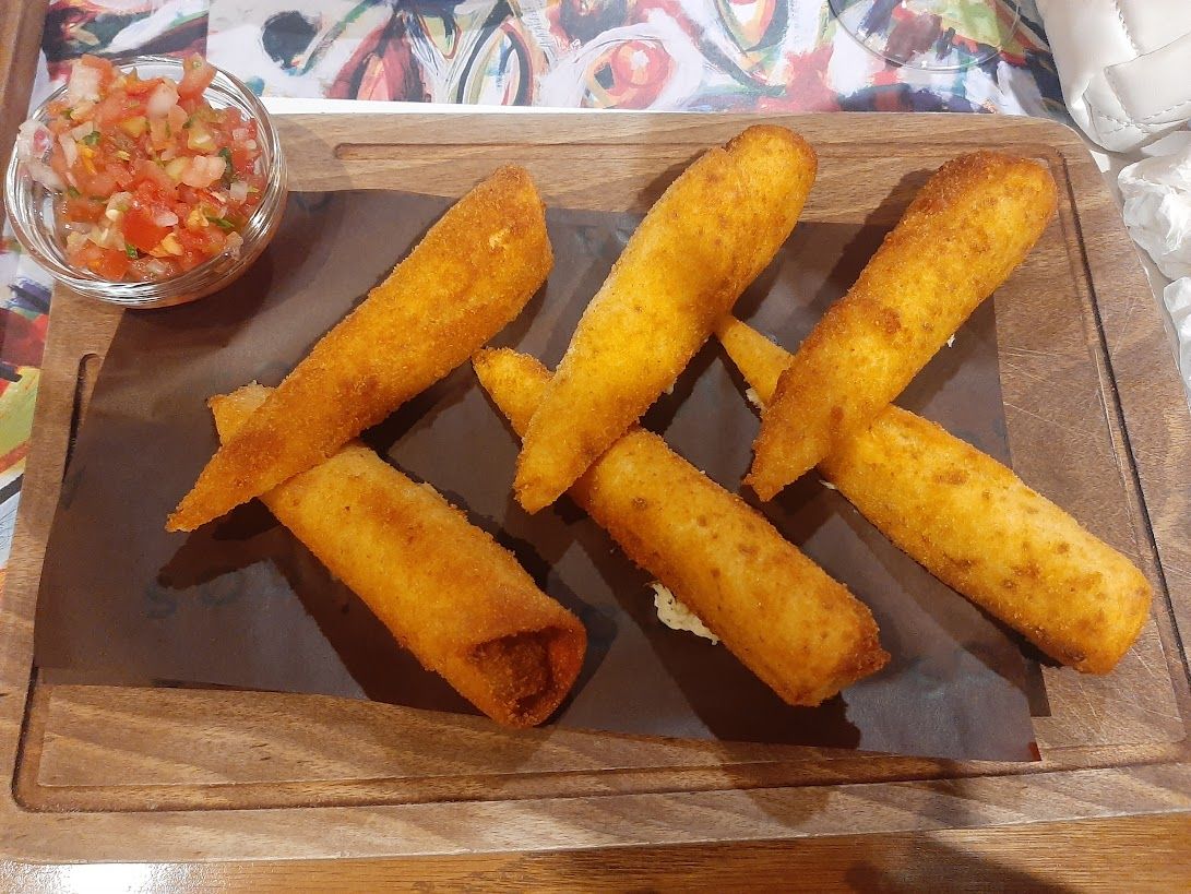 Delicious tacos and Mexican specialties served with vibrant colors and rich flavors at Amigos