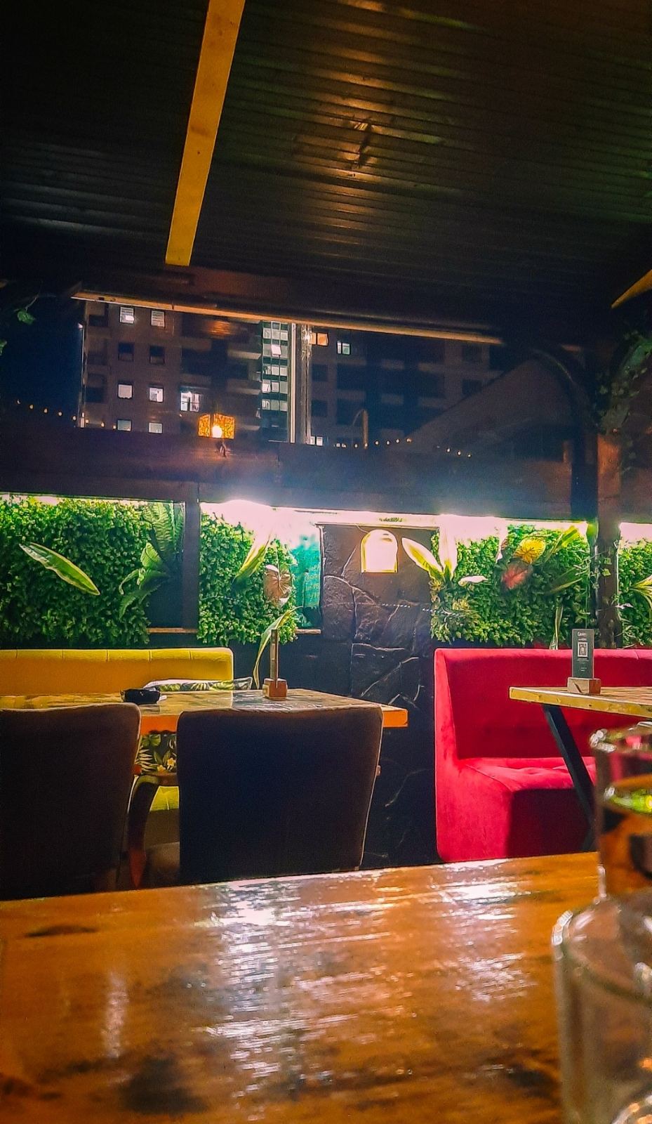 The warm inviting ambiance of Srekja Bar Food with its signature colorful wall art and cozy seating