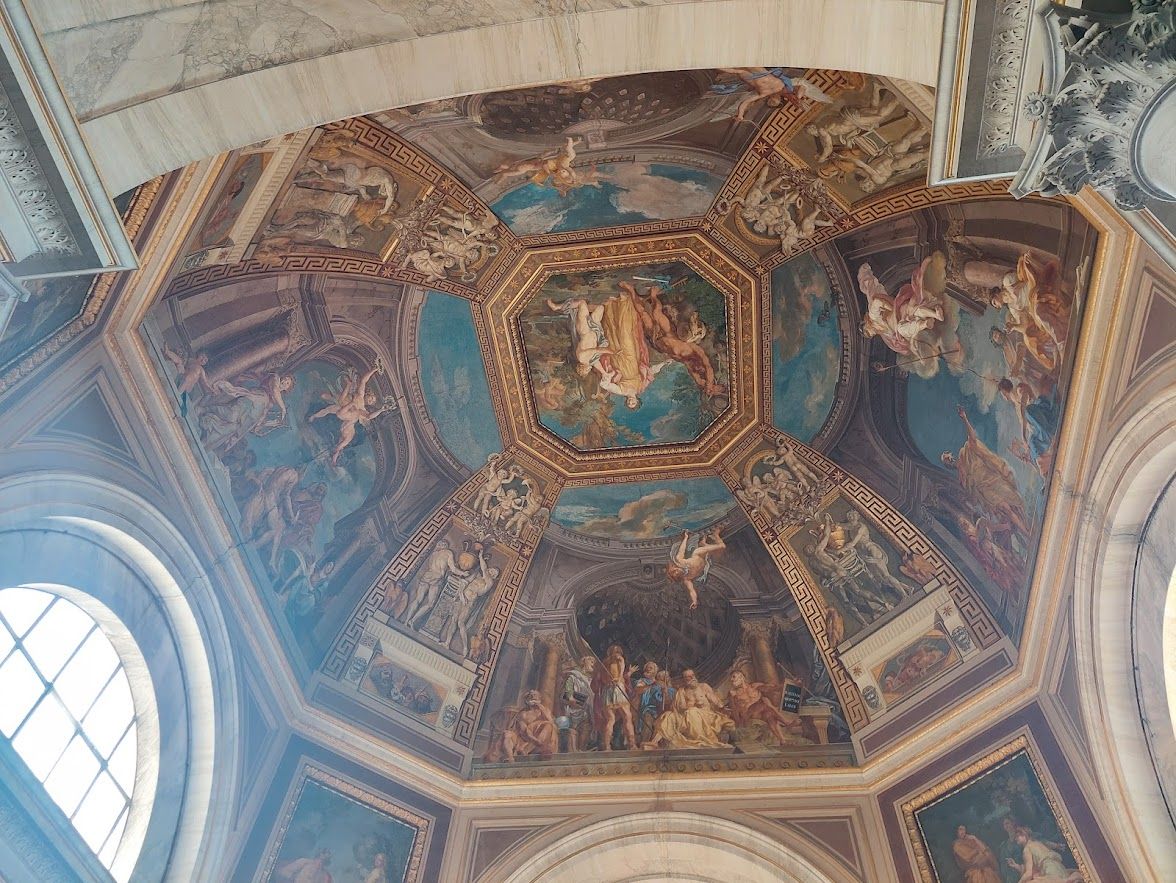 Magnificent Renaissance paintings adorning the walls and ceilings of the enormous Vatican Museums