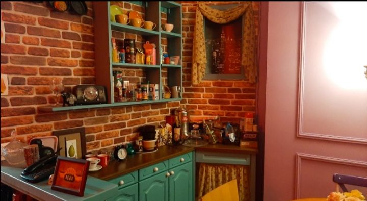 A wide view of the full Central Perk cafe interior showing the complete Friends-inspired setup in Skopje