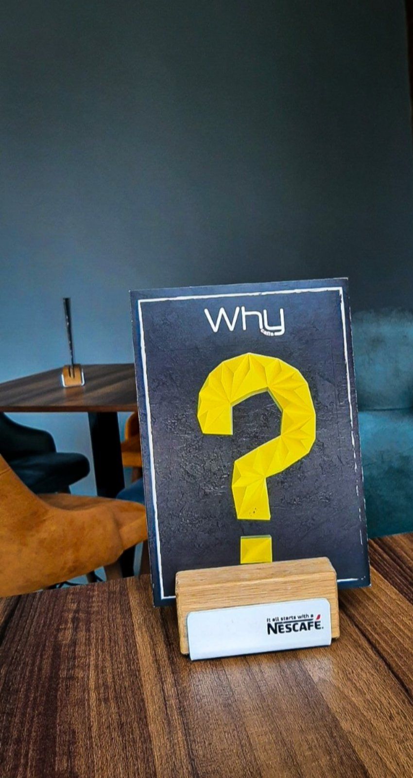 The creative menu board at Why Caffe featuring a variety of specialty coffees and drinks