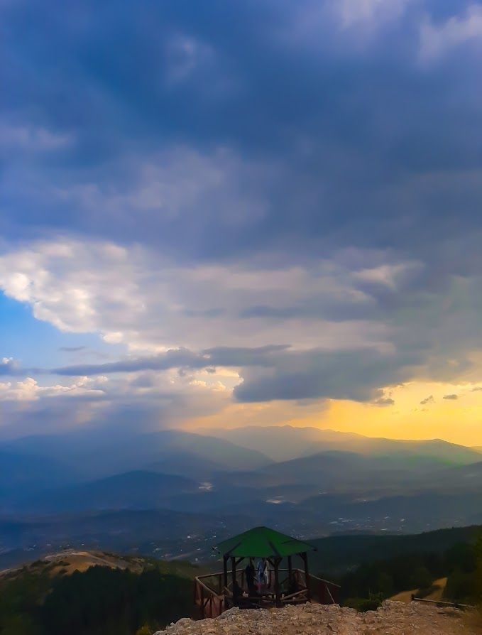 A stunning sunset view from the top of Vodno as the sun comes out of the clouds to caress you