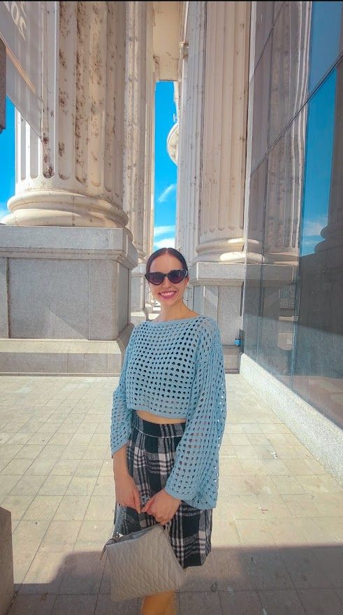 Close-up of the plaid skirt pattern paired with black accessories for an elegant autumn look