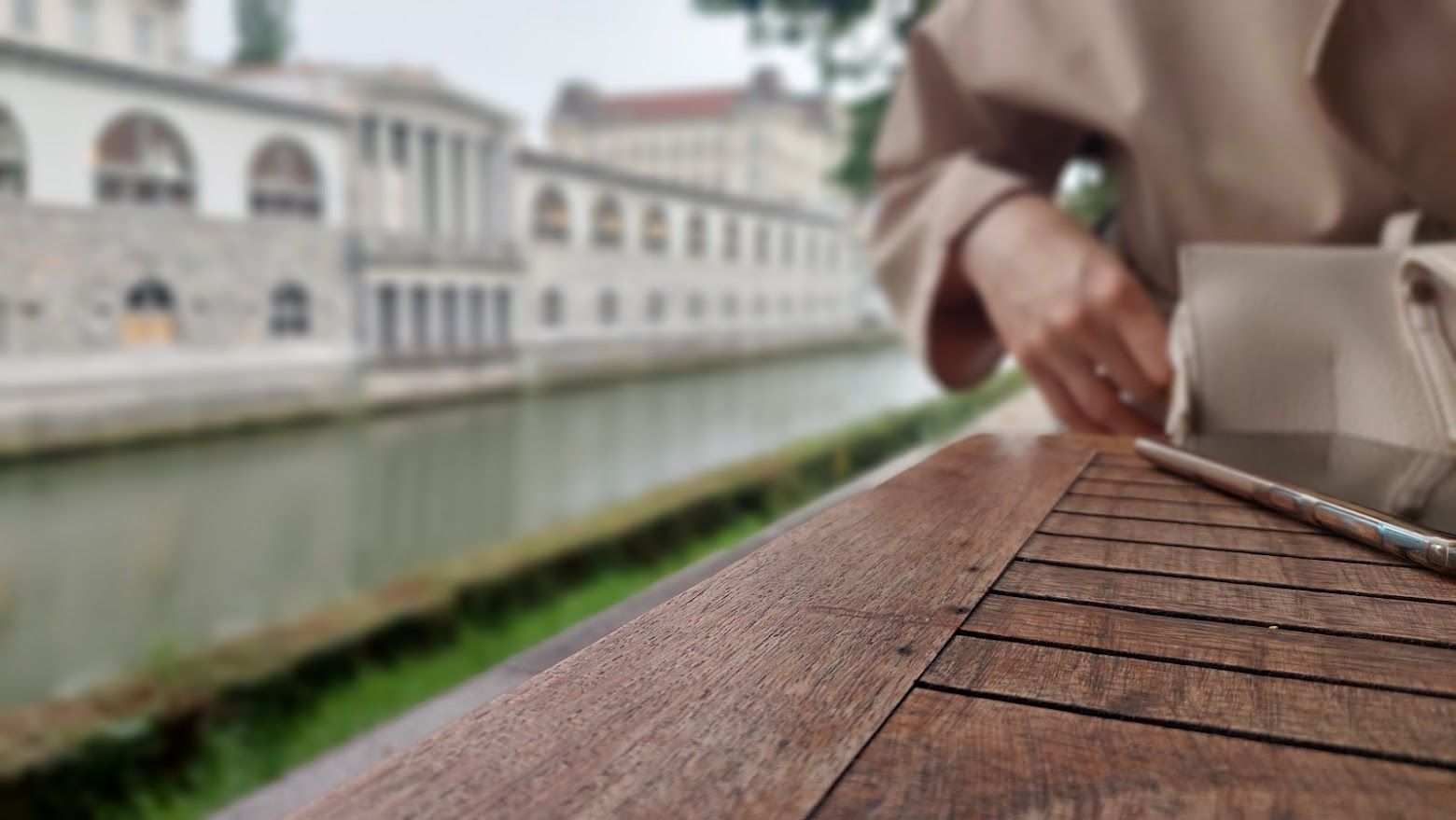 The dining experience at Fany and Mary with boats in the river and Ljubljana charm all around