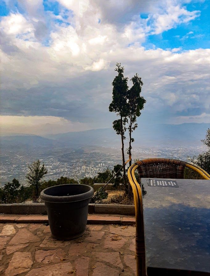 Resting at the peak of Vodno with a hot beverage enjoying the panoramic view of Skopje below