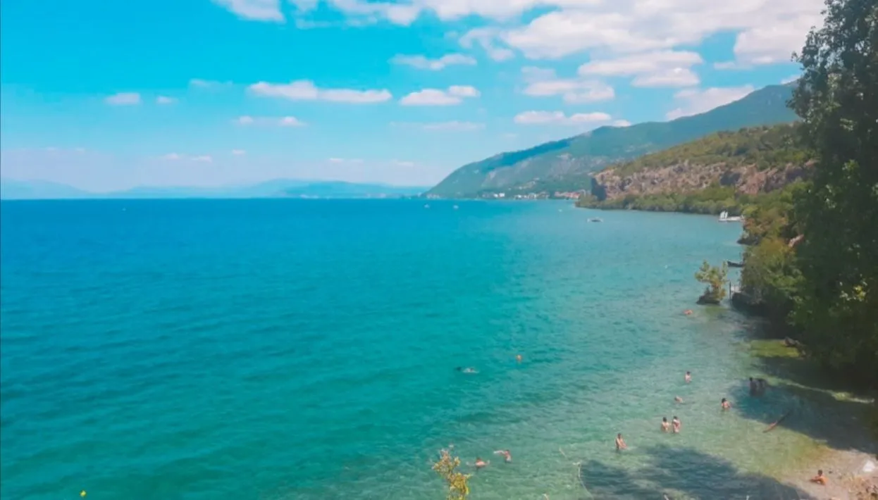 An aerial view of the stunning Ohrid Lake with the old town and mountains in the background
