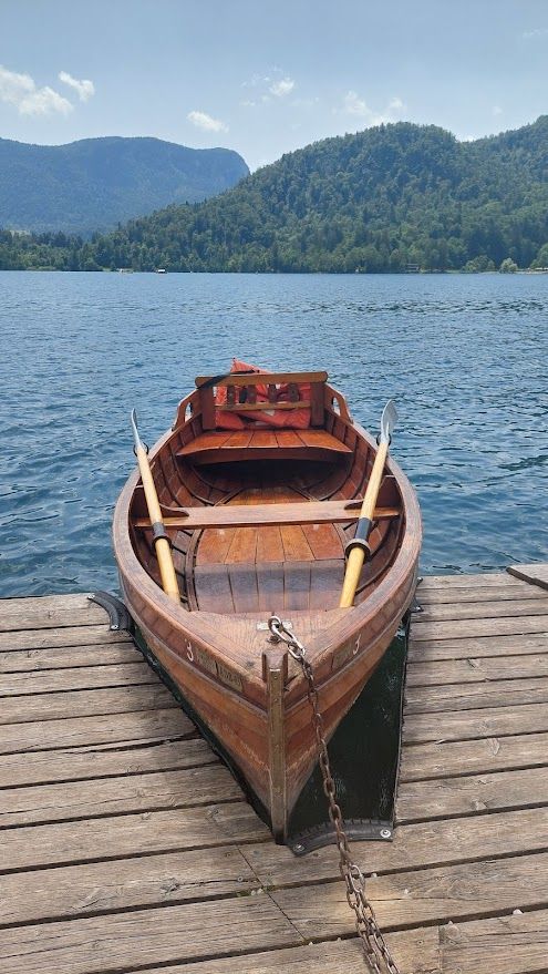 Walking along the lakeside in Bled enjoying the crystal-clear Alpine water and fresh mountain air