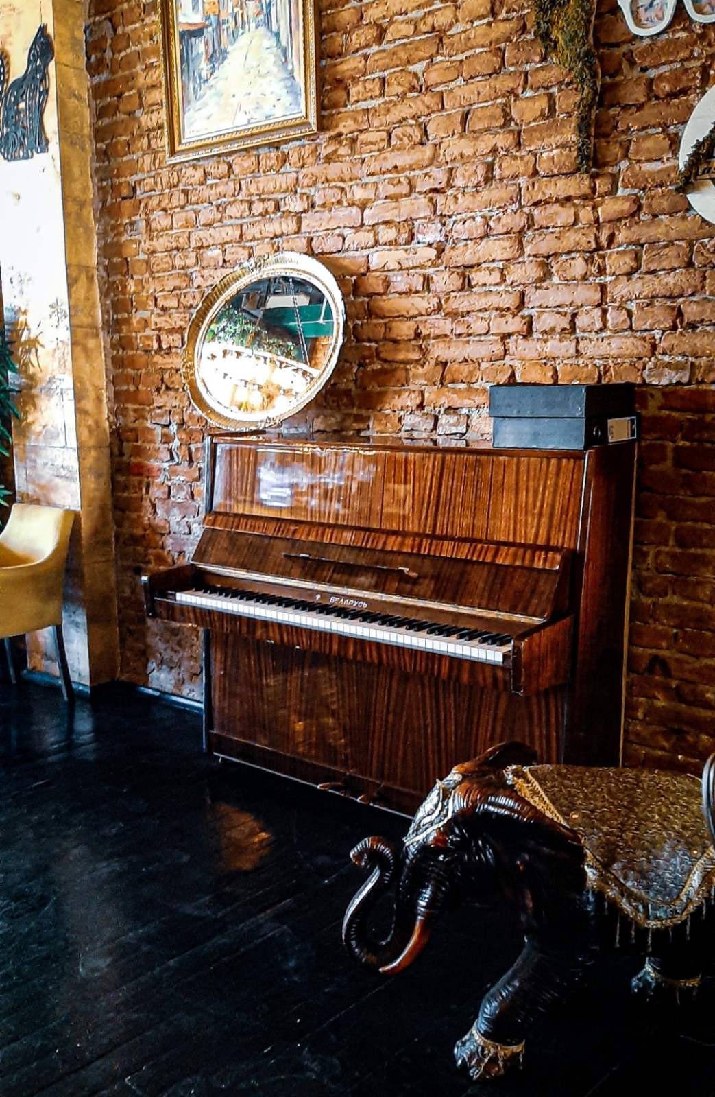 An elegant piano area inside the Austrian Palace Lounge Bar surrounded by opulent Old Bazaar architecture