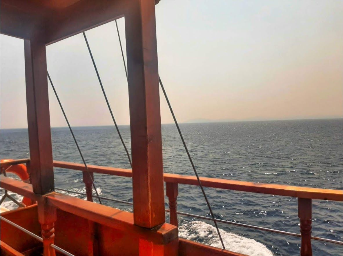 The sparkling Aegean Sea stretching endlessly as seen from the boat heading to Toroni