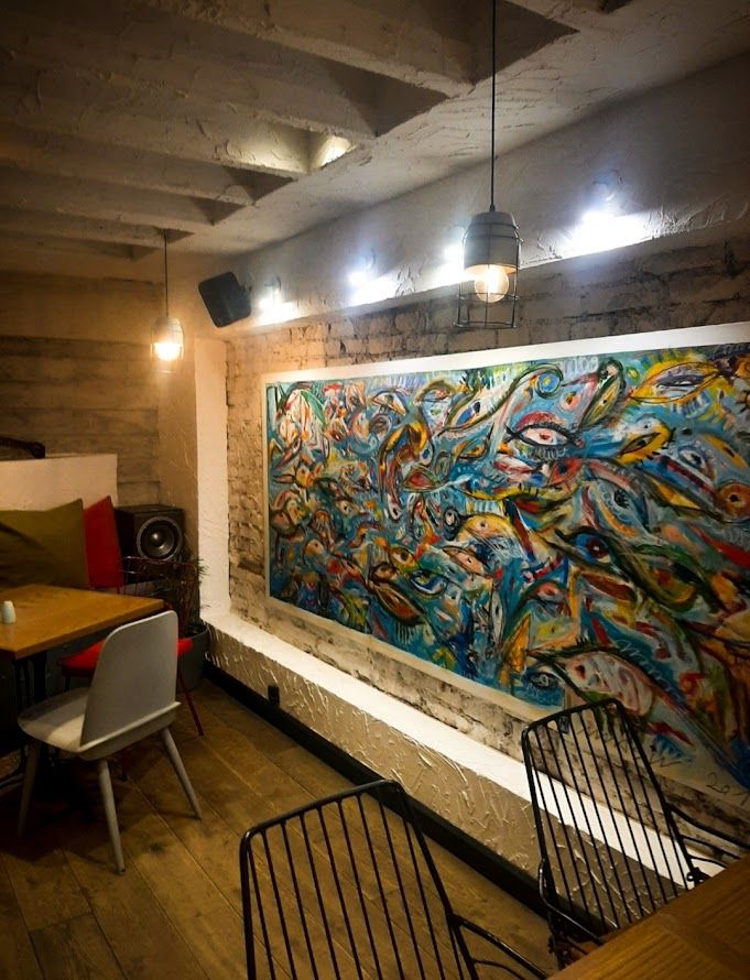 Vibrant Mexican-themed wall art and decorations at Amigos restaurant creating a festive atmosphere