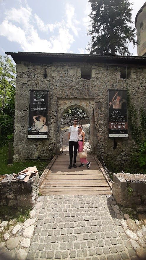 A romantic couple moment on one of the many charming bridges crossing the Ljubljanica river