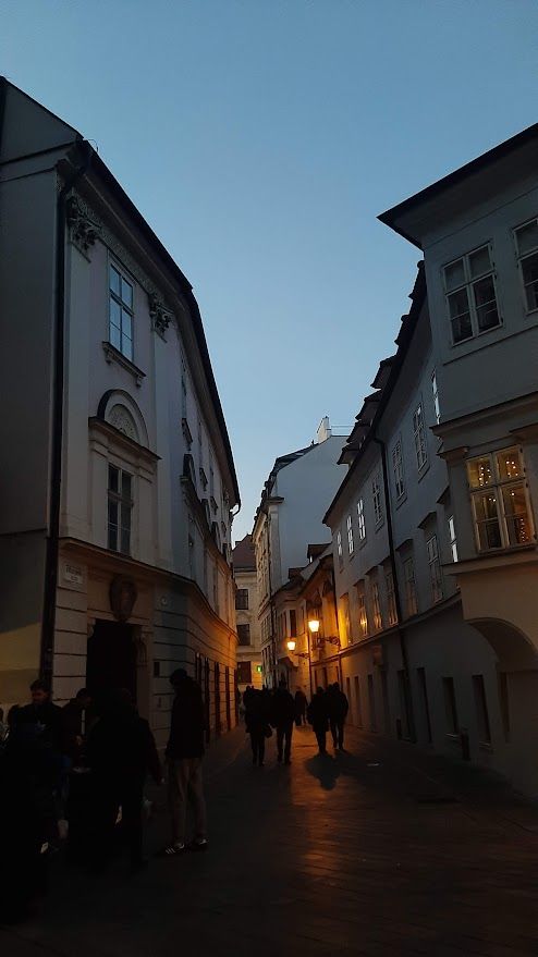 A festive street in Bratislava at night with Christmas decorations and magical winter atmosphere