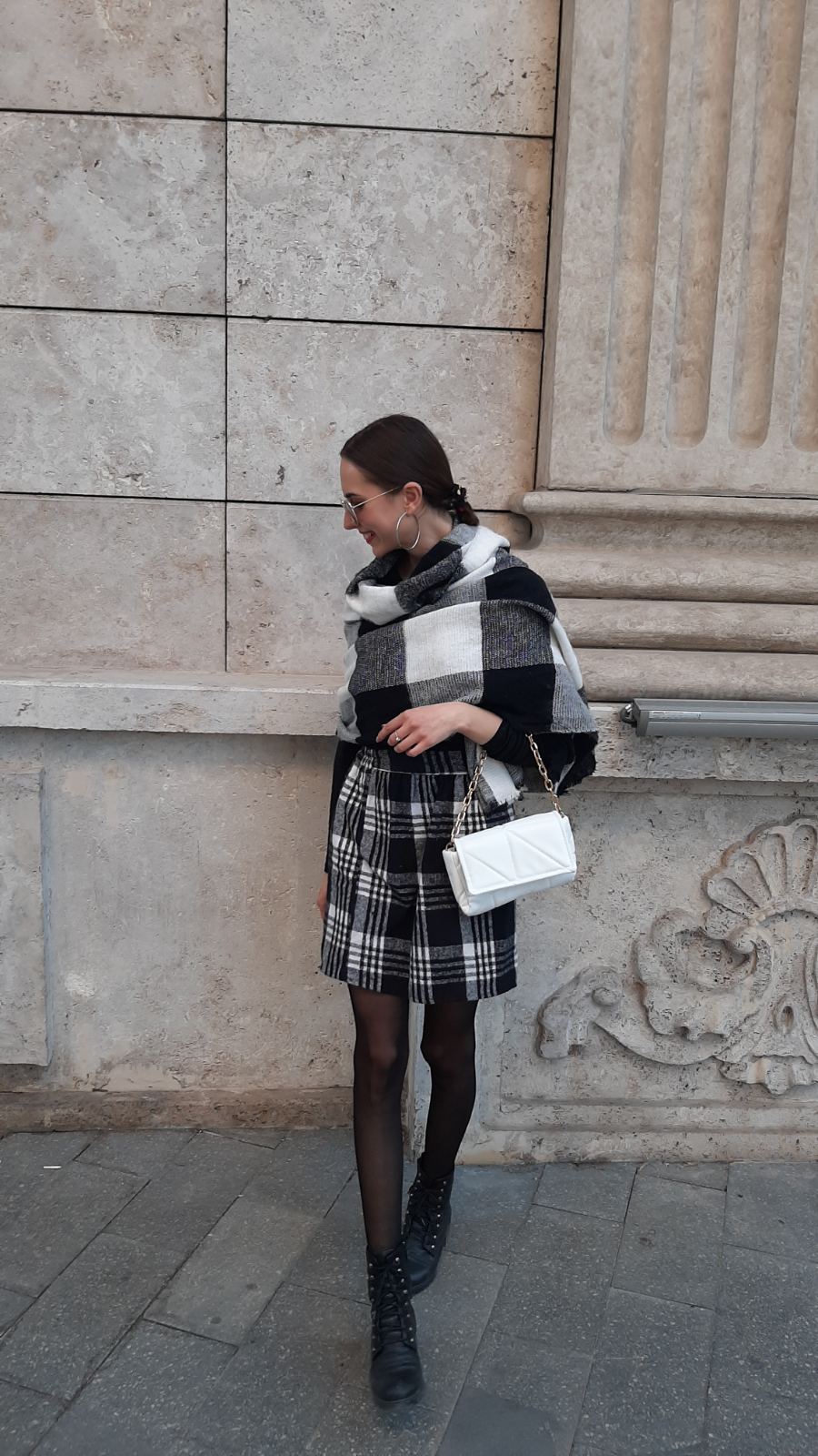 A classic plaid skirt outfit with dark tights and a beret the timeless autumn fashion staple