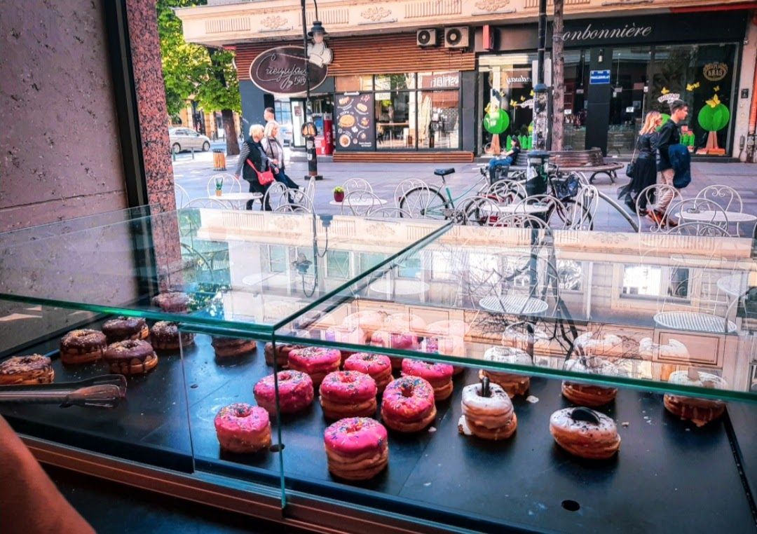 The gorgeous display case at Breadway filled with colorful macarons croissants and French treats