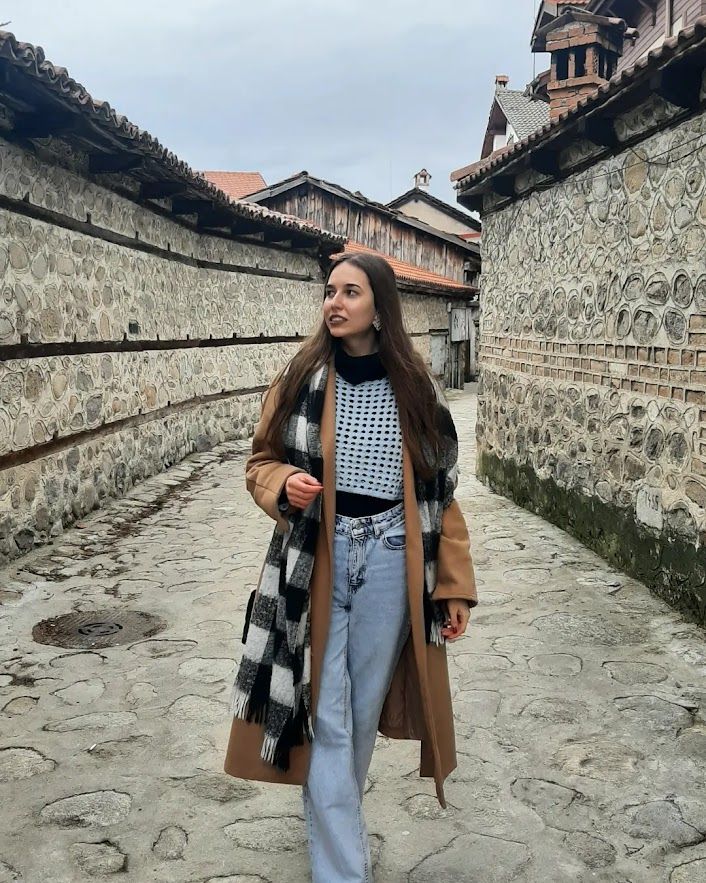 A portrait in the charming Old Town of Bansko surrounded by cobblestones and historical landmarks