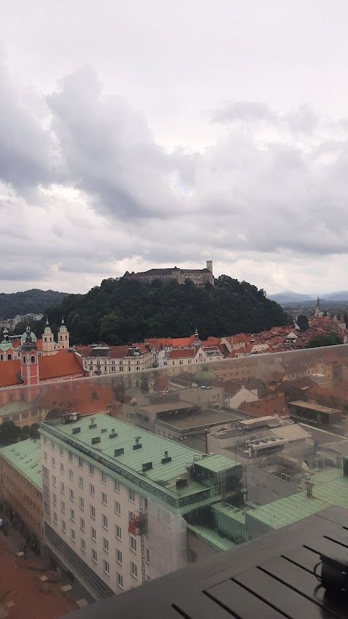 Ordering vanilla coffee at the Neboticnik rooftop while perceiving the stunning Ljubljana skyline