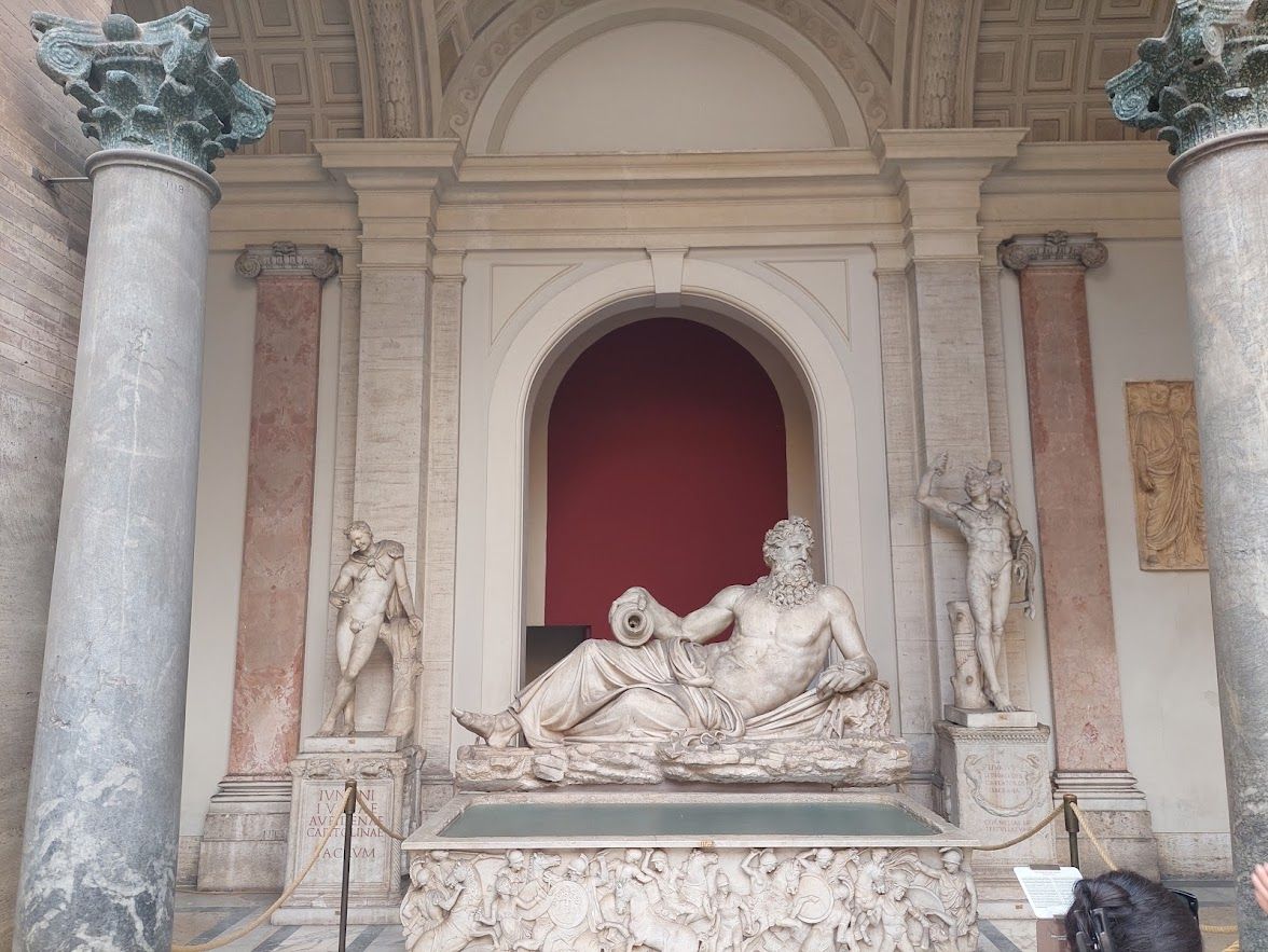 Classical sculptures and Renaissance masterpieces filling the halls of the Vatican Museums