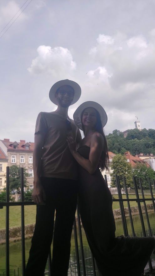 A couple exploring the romantic streets of Ljubljana guided by its lovely air filled with love