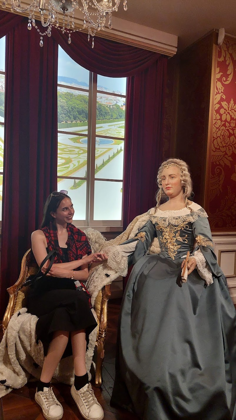 Posing beside a wax figure of Empress Maria Theresa at Madame Tussauds in Vienna