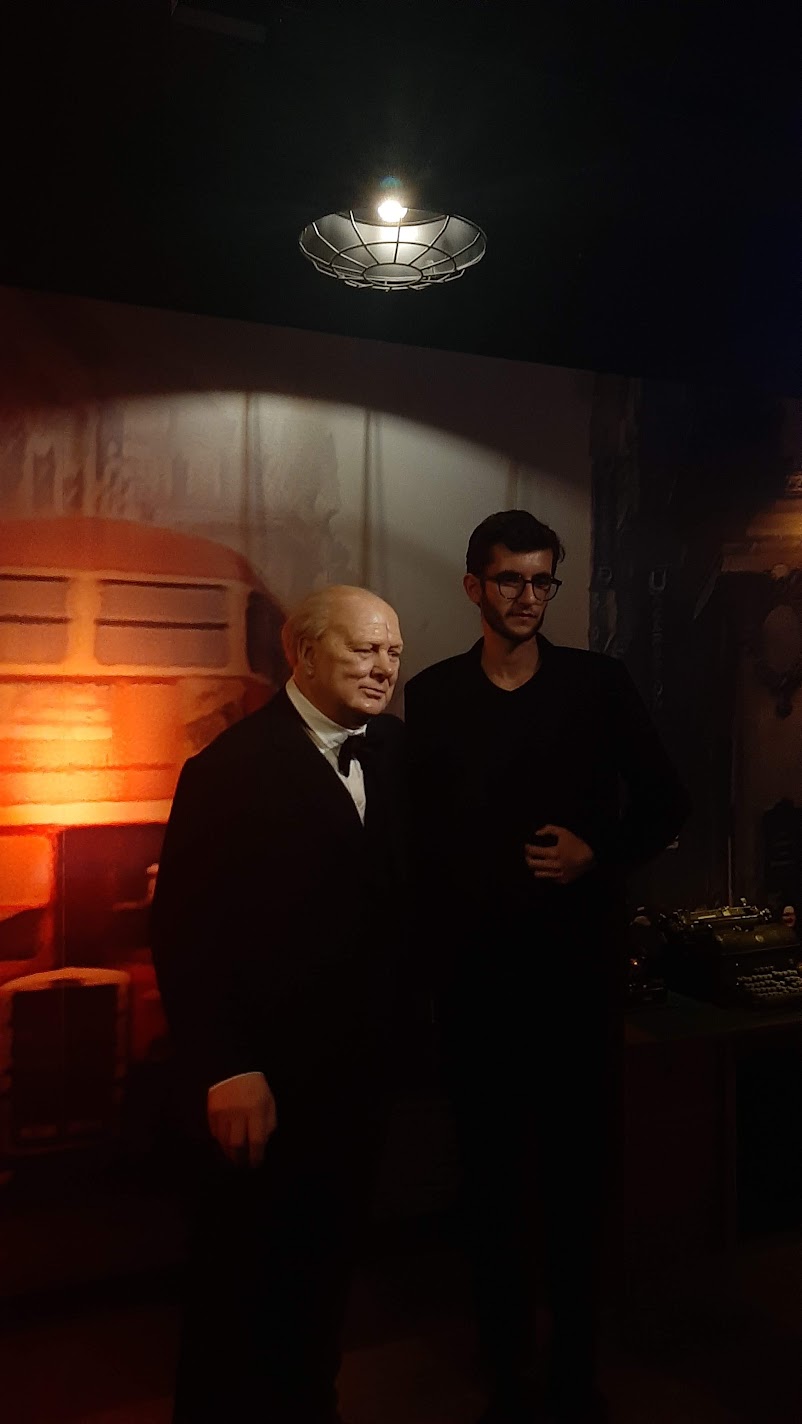 Posing with a wax figure of Winston Churchill at Madame Tussauds in Vienna