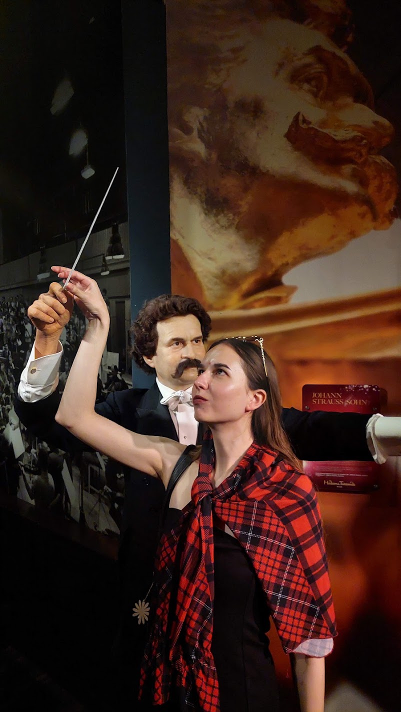A wax figure of Johann Strauss raising his baton at Madame Tussauds in Vienna