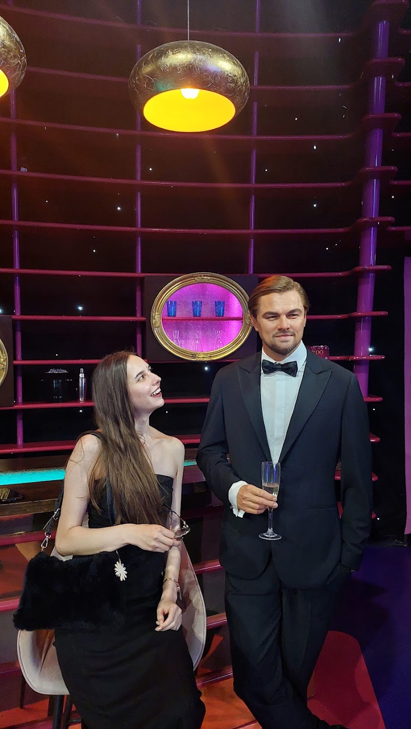 Posing with a wax figure of Leonardo DiCaprio on a Titanic-themed set at Madame Tussauds in Vienna