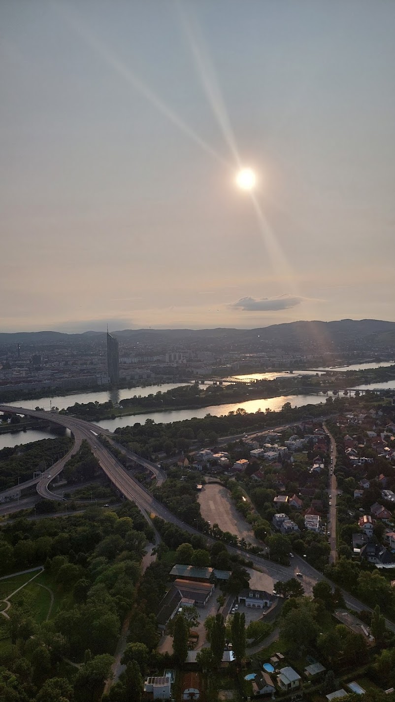 A sunset aerial view over the Danube river and Vienna from the Danube Tower