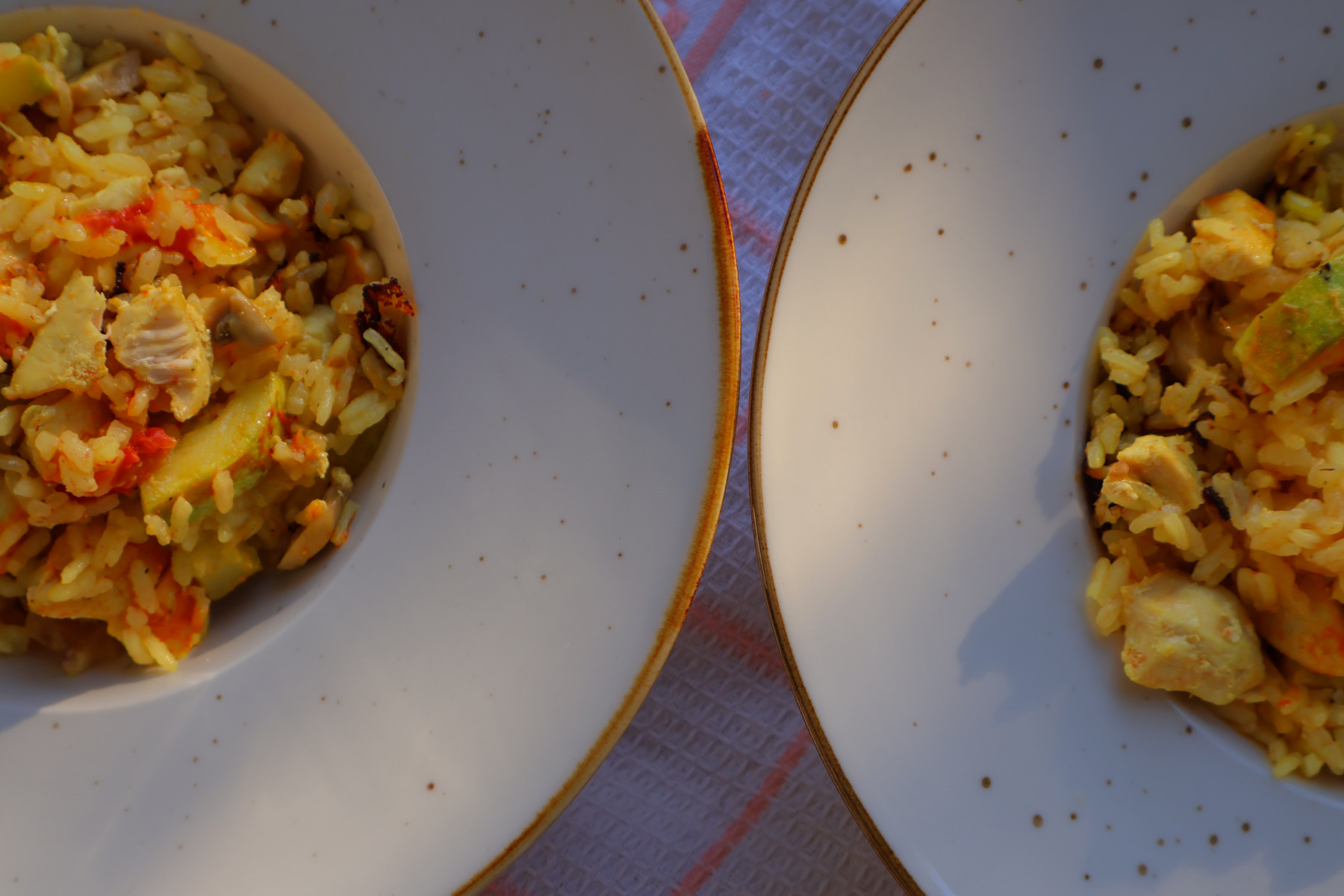 A lunch bowl of rice with chicken and courgette