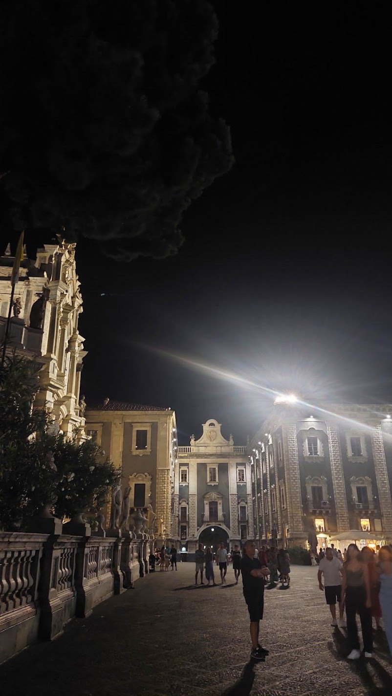 Piazza del Duomo in Catania at night, its Baroque palaces and cathedral floodlit