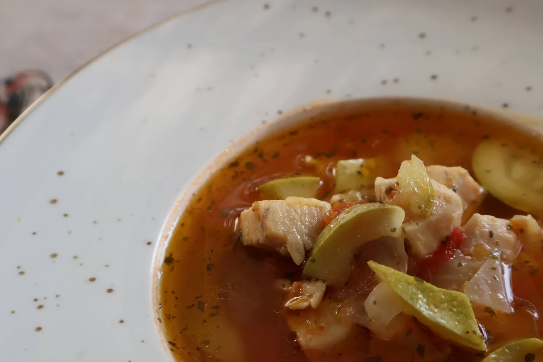 Close-up of chicken and courgette soup